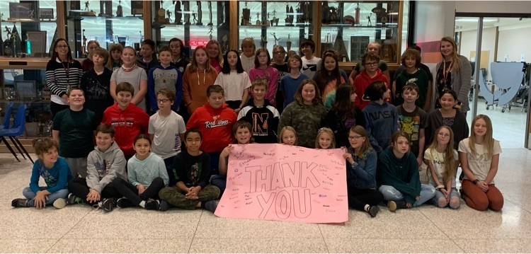 students holding a thank you banner 