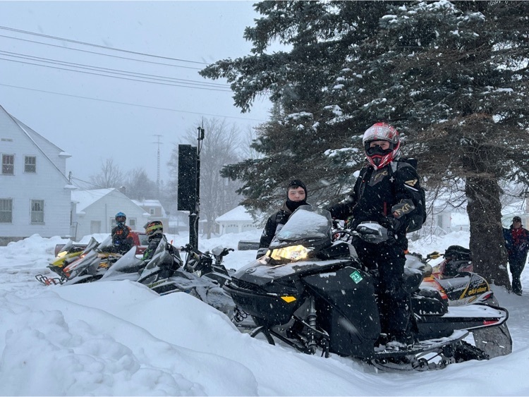 snowmobile students at school