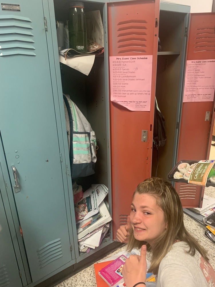 student cleaning locker