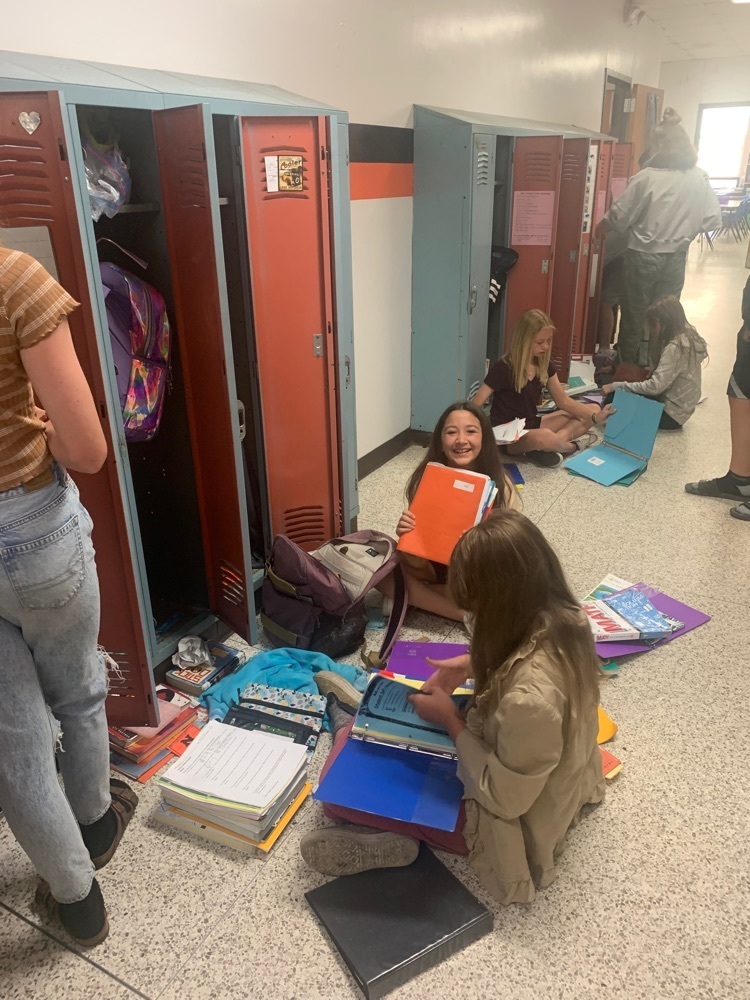 students cleaning lockers