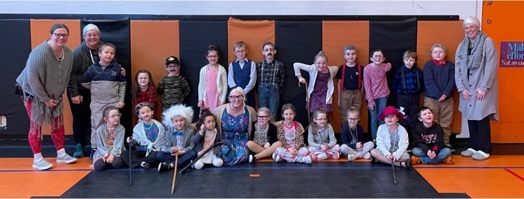 students and teachers dressed like they are 100 years old for the 100th day of school
