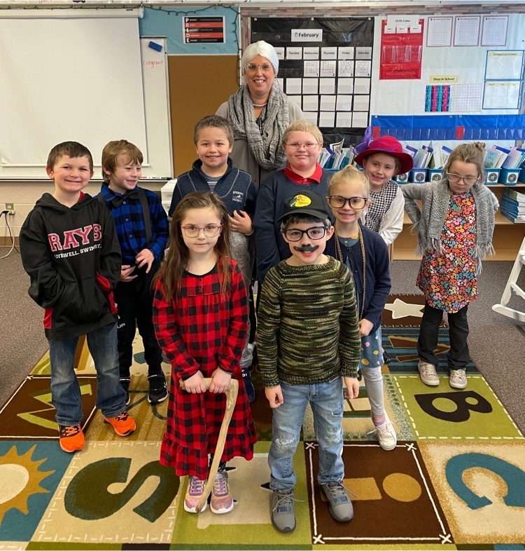 teacher and students dressed like they are 100 for the 100th day of school 